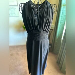 Black float midi dress with a V-neckline & cinched waist.